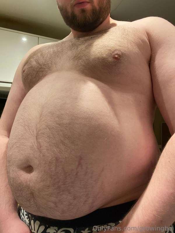 the packed belly of a fat boy who's just had a huge dinner (..