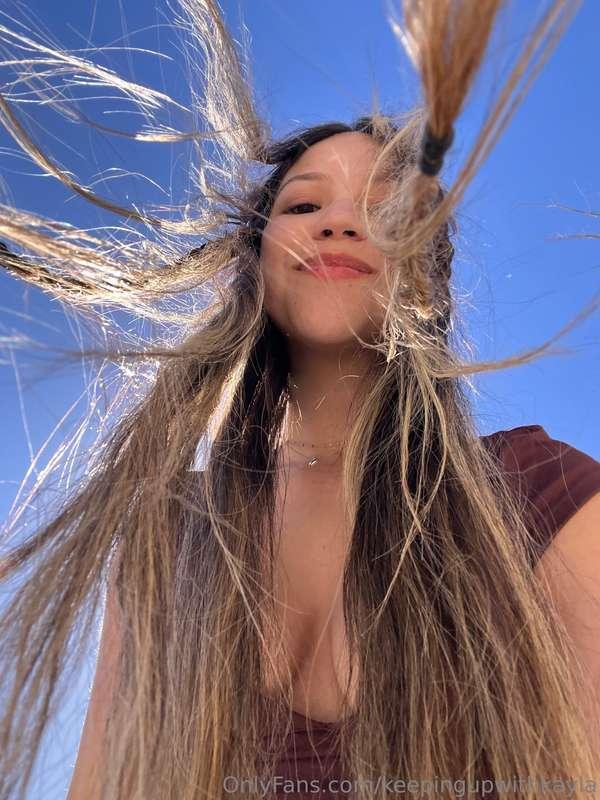 Smiling under the sun, feeling a little shy but extra cute t..