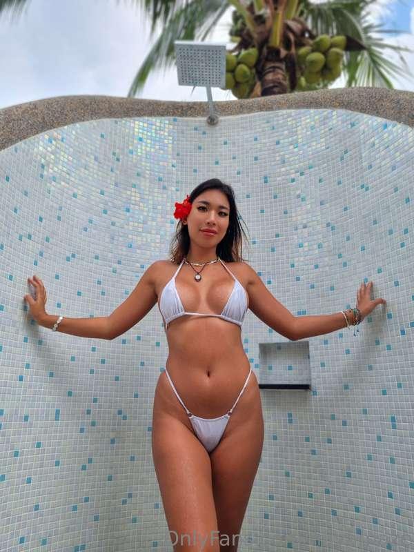 Do you like me in this bikini and cute red flower on my head..
