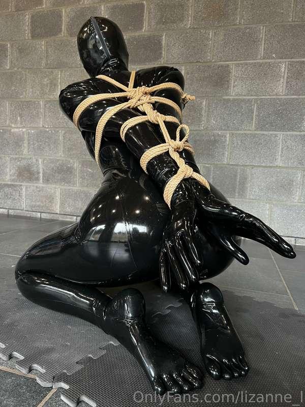 Strapado in a full latex outfit. What is not to like?