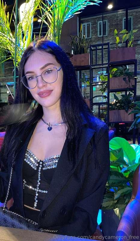 Dining in sophistication, draped in black attire at the fine..