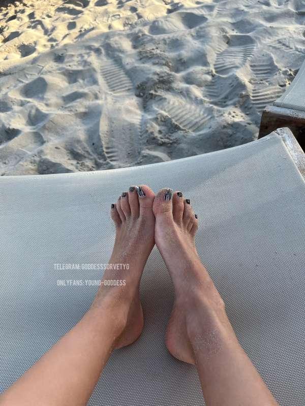 There is a lot of sand on my beautiful feet. Do you think th..