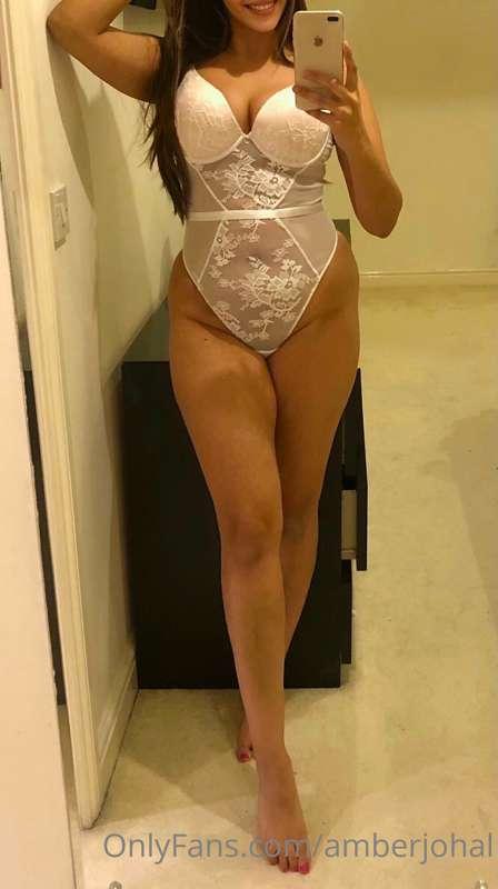 Wearing white lace lingerie like a virgin, ready to be touch..