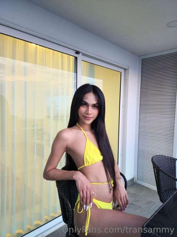 Dressed in yellow, She says "hello". Come sit next to me you..