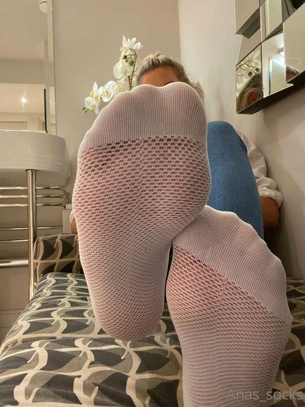 Taking my socks off after a long day  to see how they smell…..