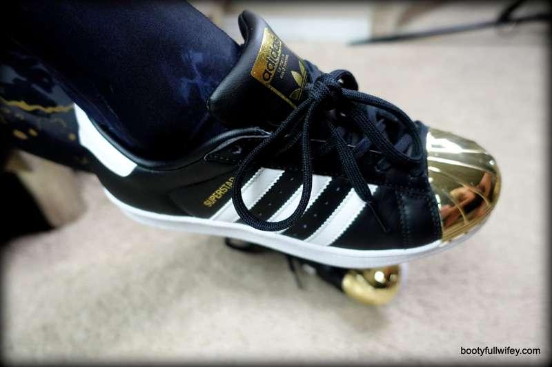 Snaps from the latest video "Black and Gold Superstar Shoejo..