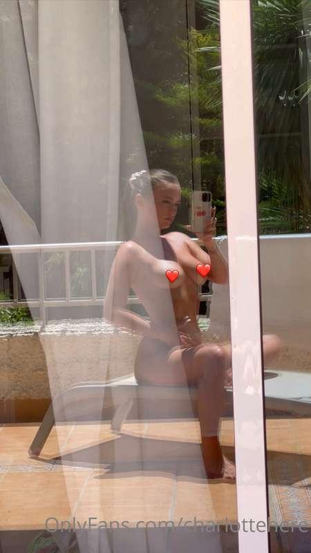 Topless on the balcony getting naughty