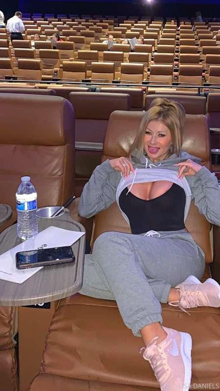 FLASHING TITTIES IN THE MOVIE THEATER.  CHECK YOUR INBOX