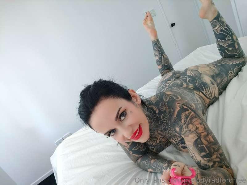 On the bed with my selfie stick showing all the good spots 😏..