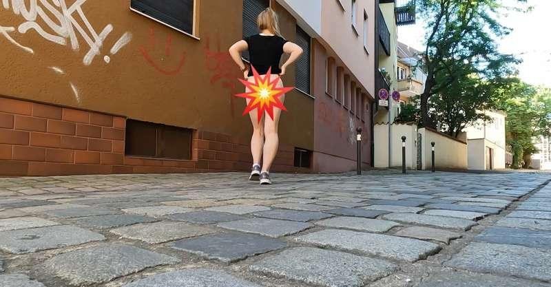 I walk through a street showing my butt. 🤭 In the video, you..