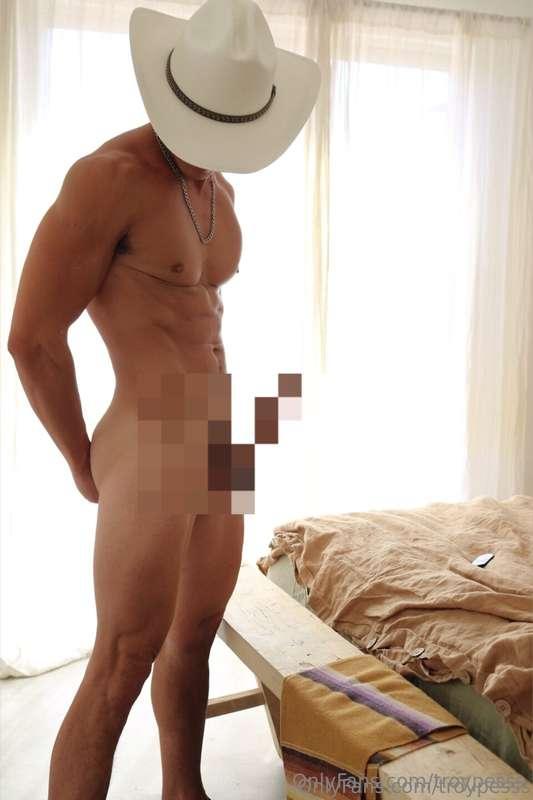 You favorite cowboy standin by the bed, cock out and ready t..