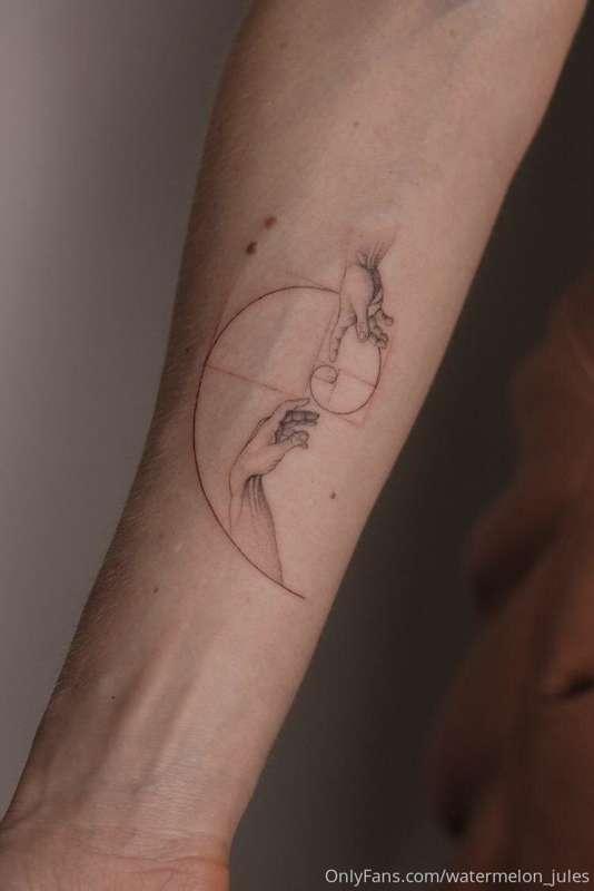 My tattoo.. Da Vinci hands ( the Creation of Adam) and Fibon..