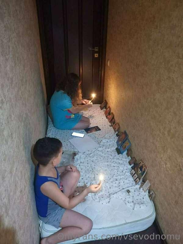 Ukraine. Dnipro. Children pray for their lives during the th..