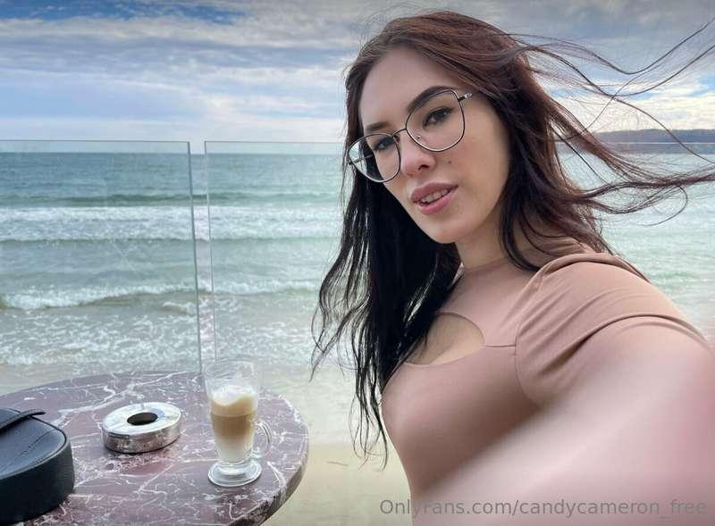 I find myself nestled in a quaint seaside café, where time d..