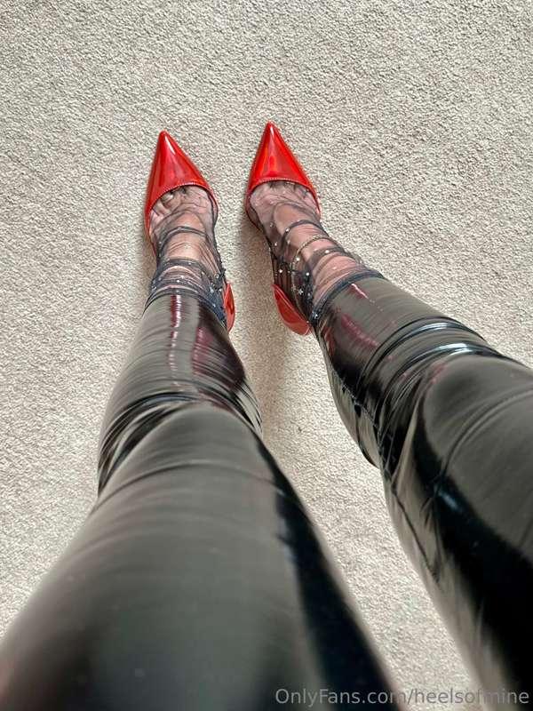 Red heels and shiny leggings