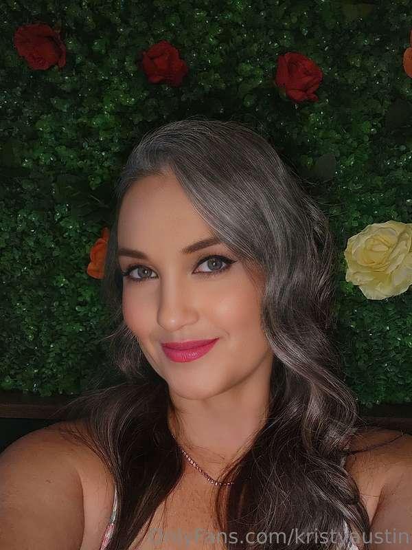 Just a fairy in a garden of roses sprinkling pixie dust on y..