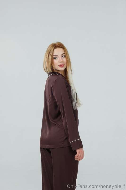 Dressed in a cozy brown satin pajama, I'm having a delightfu..