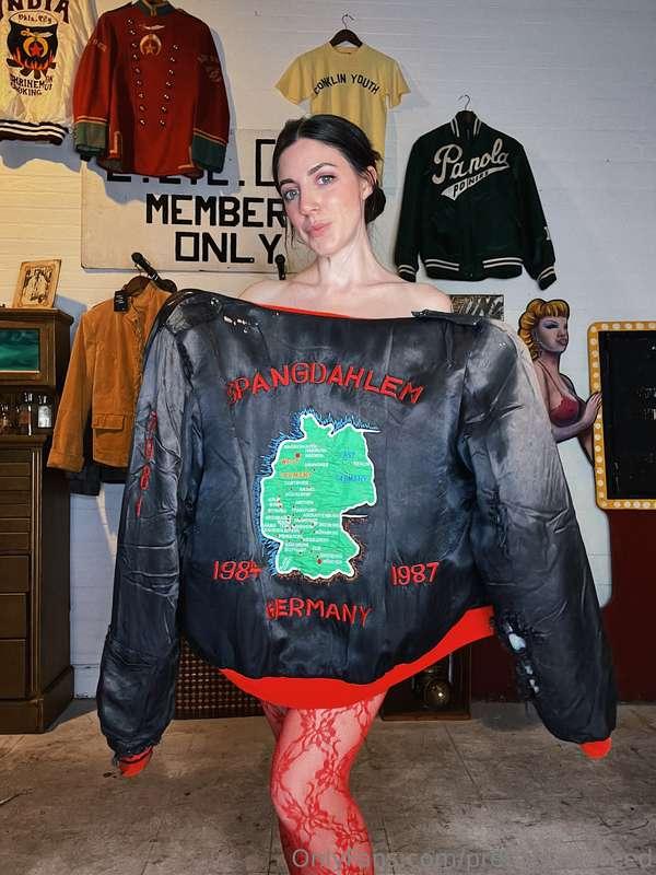 A military souvenir jacket from Germany and a pair of lace t..