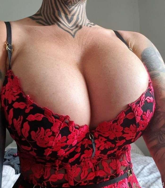 Imagine a big cock, oiled up between these big fake tits...s..