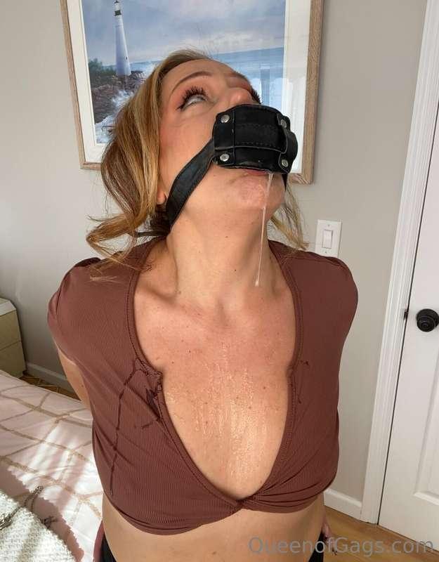 Drool covered from the dildo gag