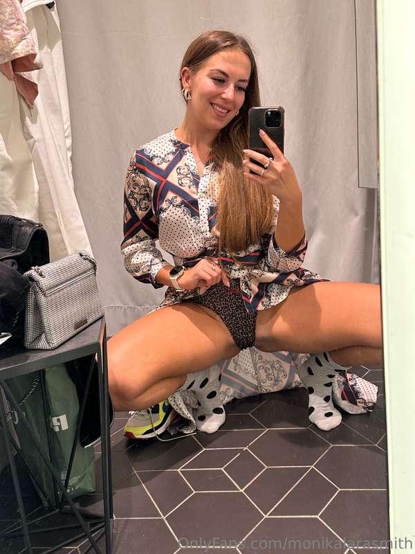 Inside a fitting room trying on this dress looks great and c..