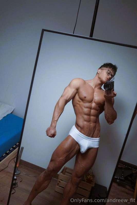 Snapping this shot with my digital cam topless, abs tight, a..