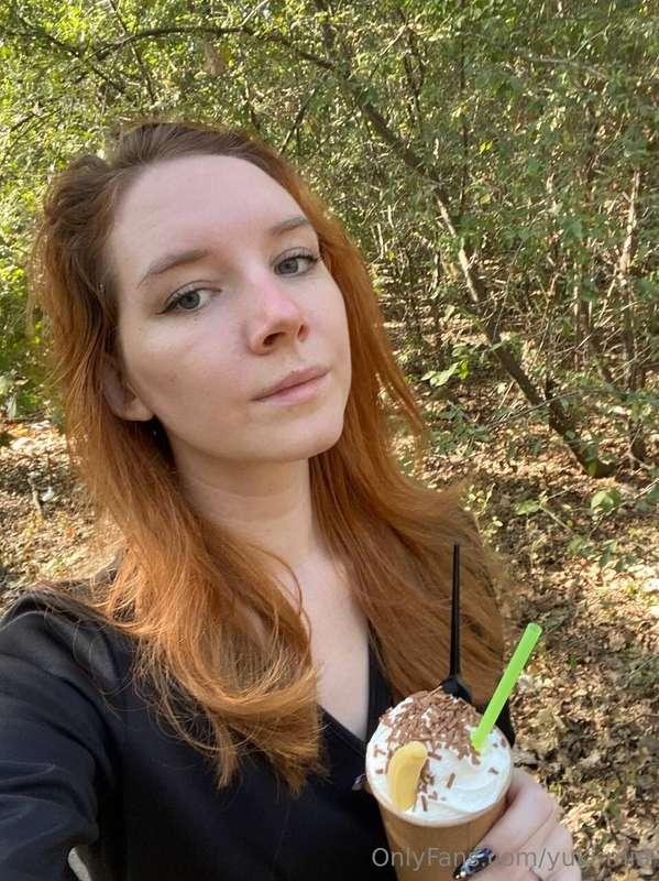 Amidst the tranquil woods, she savors a beautifully crafted ..
