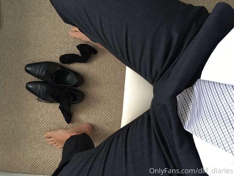 Feet, arse and suited bulge