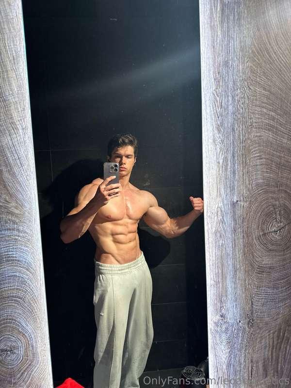 Flexing for you in the mirror, abs tight, cock straining thr..