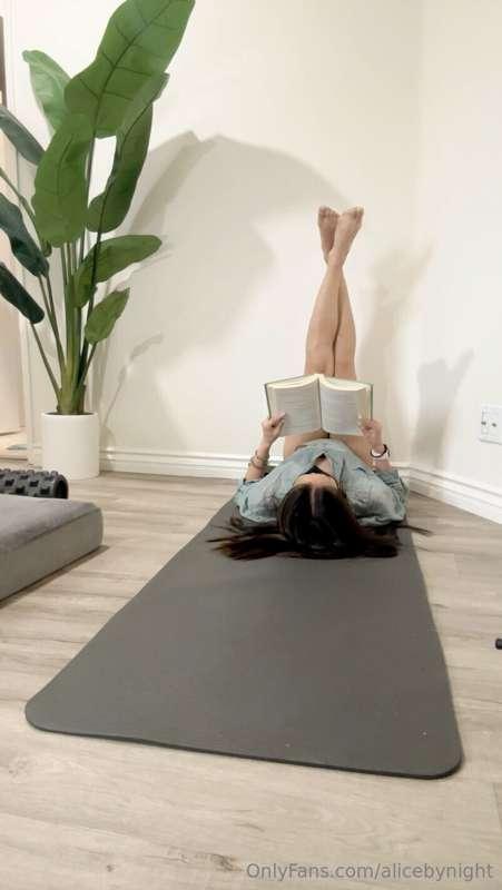Relaxing on my yoga mat, engrossed in a captivating book. Th..