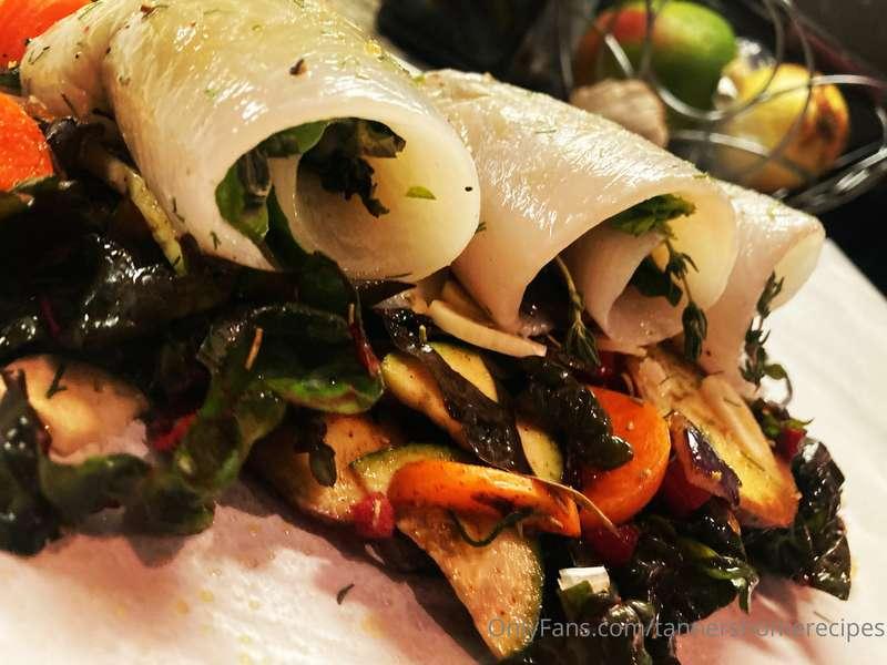 Basil thyme stuffed sole on swiss chard yams carrot onion an..