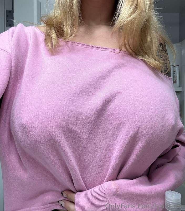stripping this off then oiling my tits up to play with them ..