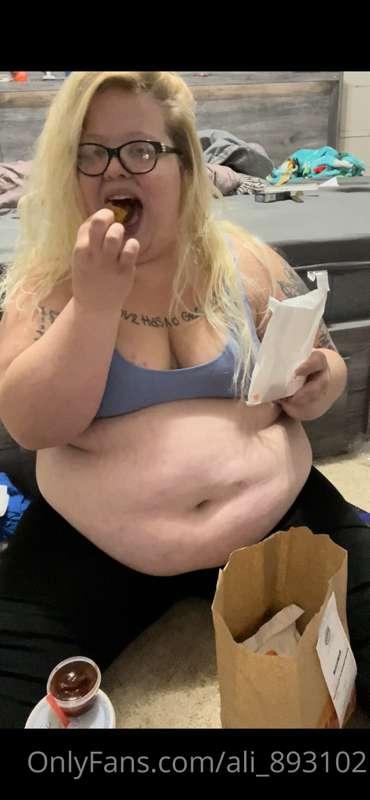 1 spicy chicken sandwich, 8 chicken nuggets, fries, and 4 mo..