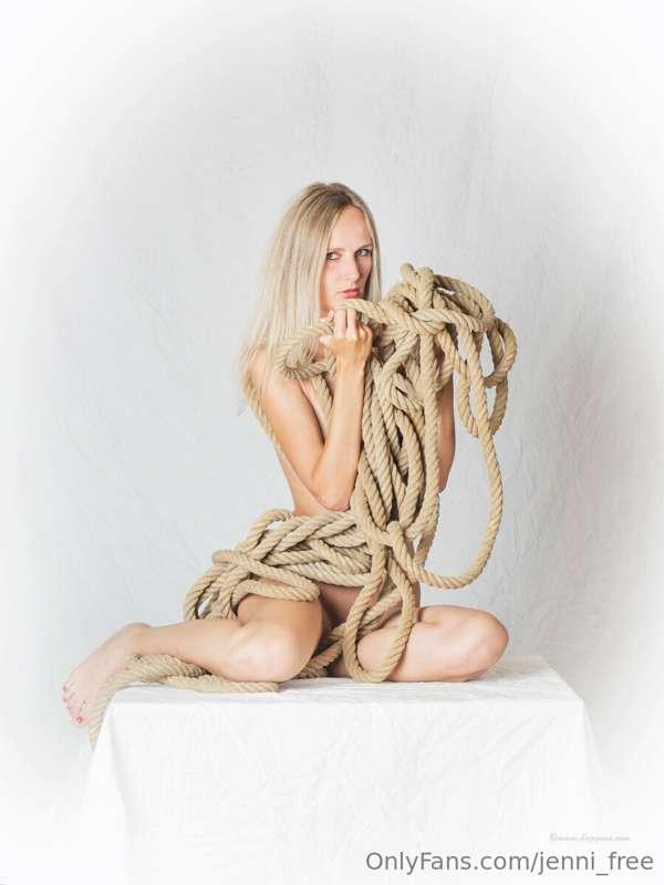 Nude shooting wearing only rope