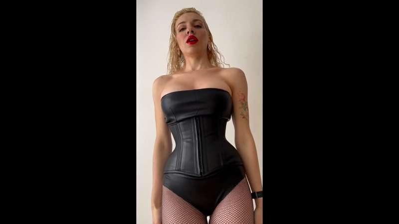 backstage in leather corset and fishnet