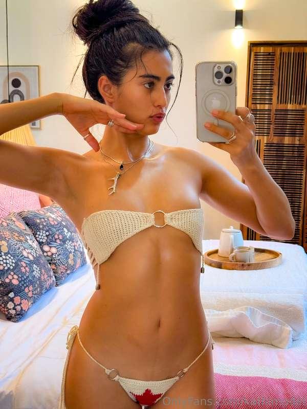 Star bikini ⭐️As I gaze into the mirror, the reflection capt..