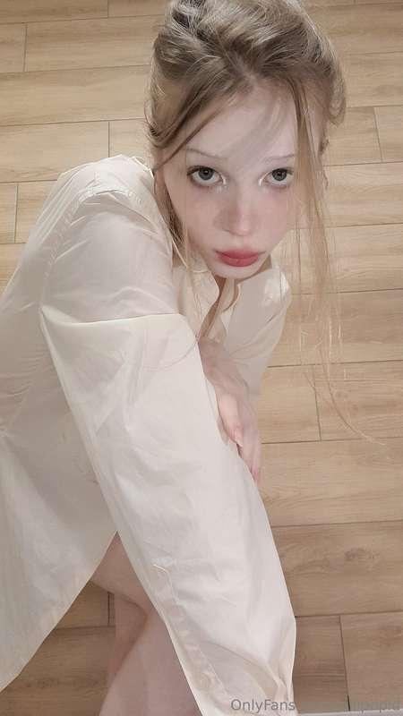 A white men's shirt on a woman's body looks so elegant and e..