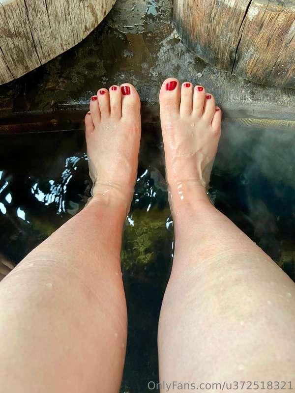 These toes are on an international vacation, soaking in an o..