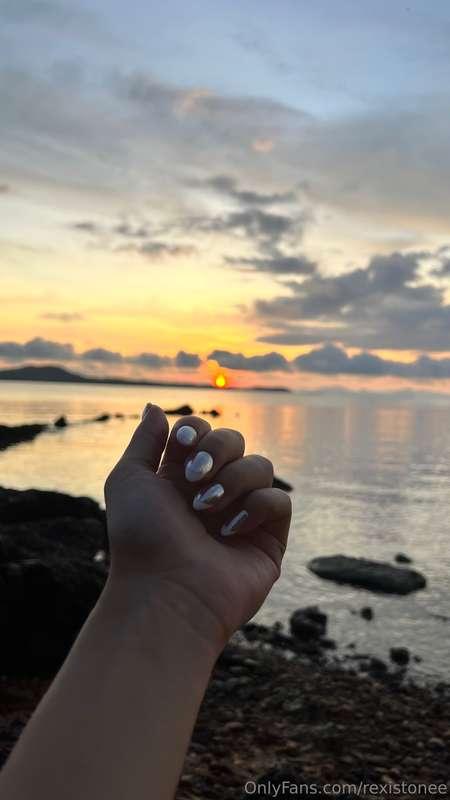 Fingers kissed by sea breeze, nails catching sunlight…Now te..