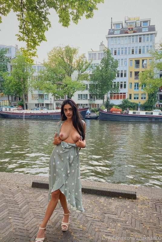Risky outdoor dressed up but tits out in Amsterdam