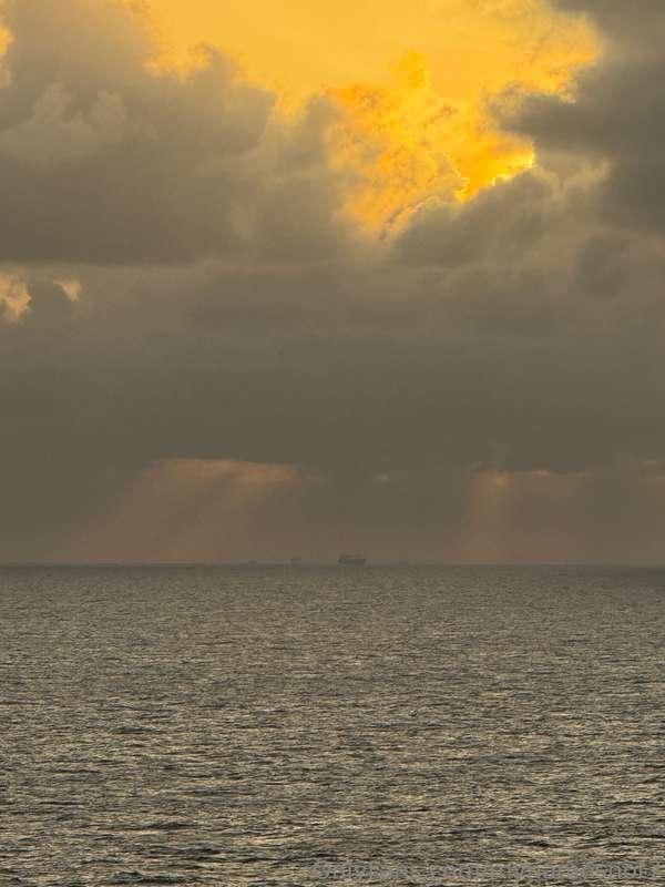 In the first pic there’s a boat in the distance, and in the ..
