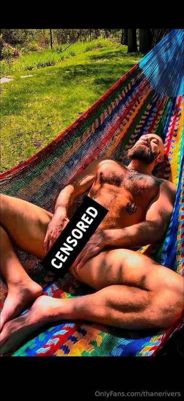 Laying out in the sun in a hammock completely naked…. Hmmm, ..