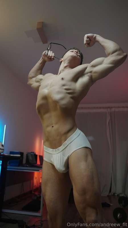 Flexing every muscle, biceps tight, briefs stretched by this..