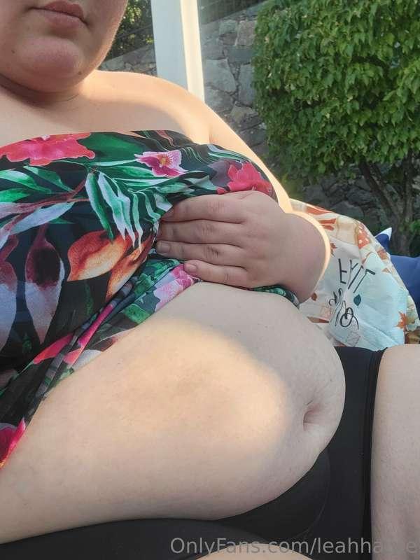 At the pool about to devour pizza and a steak and cheese!
