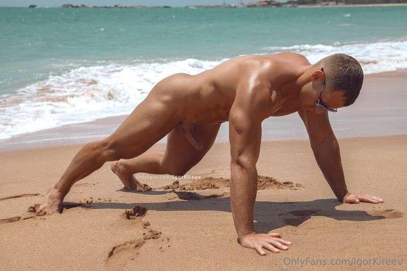 Naked stretching from @superstas on a deserted beach  Hot mu..