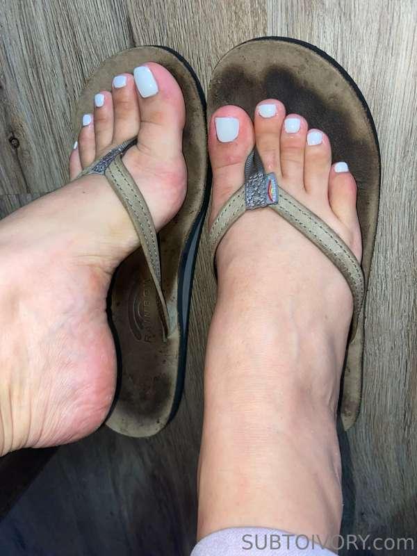 He loves my foot stained rainbow flip flops 👀