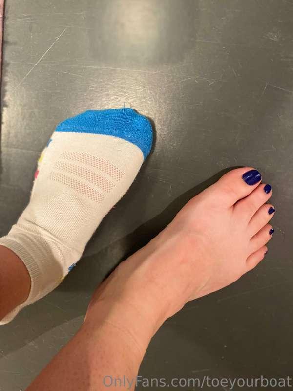 Sweaty feet post workout, leaving prints on the bathroom flo..