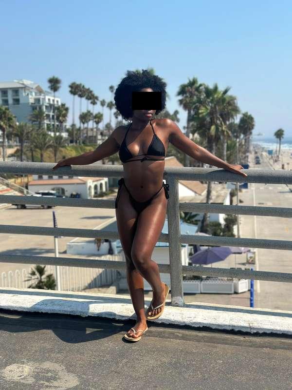 At the beach showing off cheeks for all the white men that I..