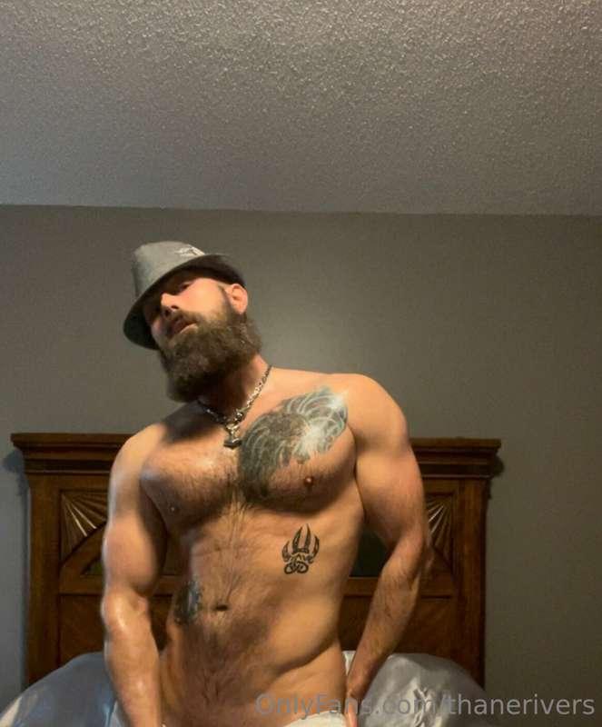 A bit oiled up, some swollen muscles, a fedora and oh…. What..