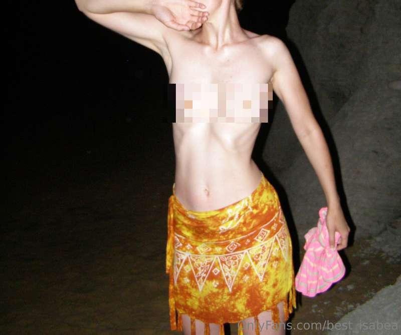 As I stepped onto the moonlit beach, I shed my top, and with..